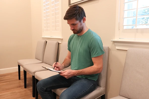 Chiropractic San Antonio TX Filling Out Paperwork